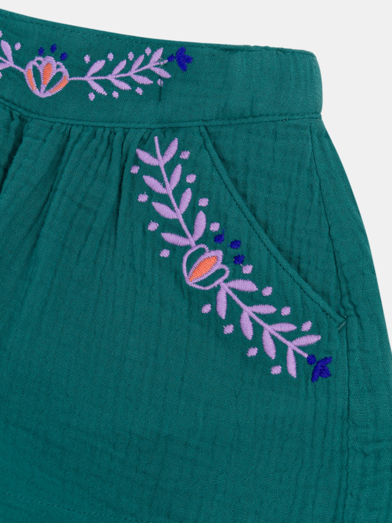 Green shorts with floral embroidery for girls
