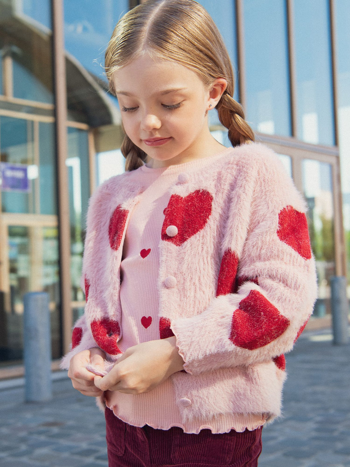 Pink cardigan with heart pattern for girls