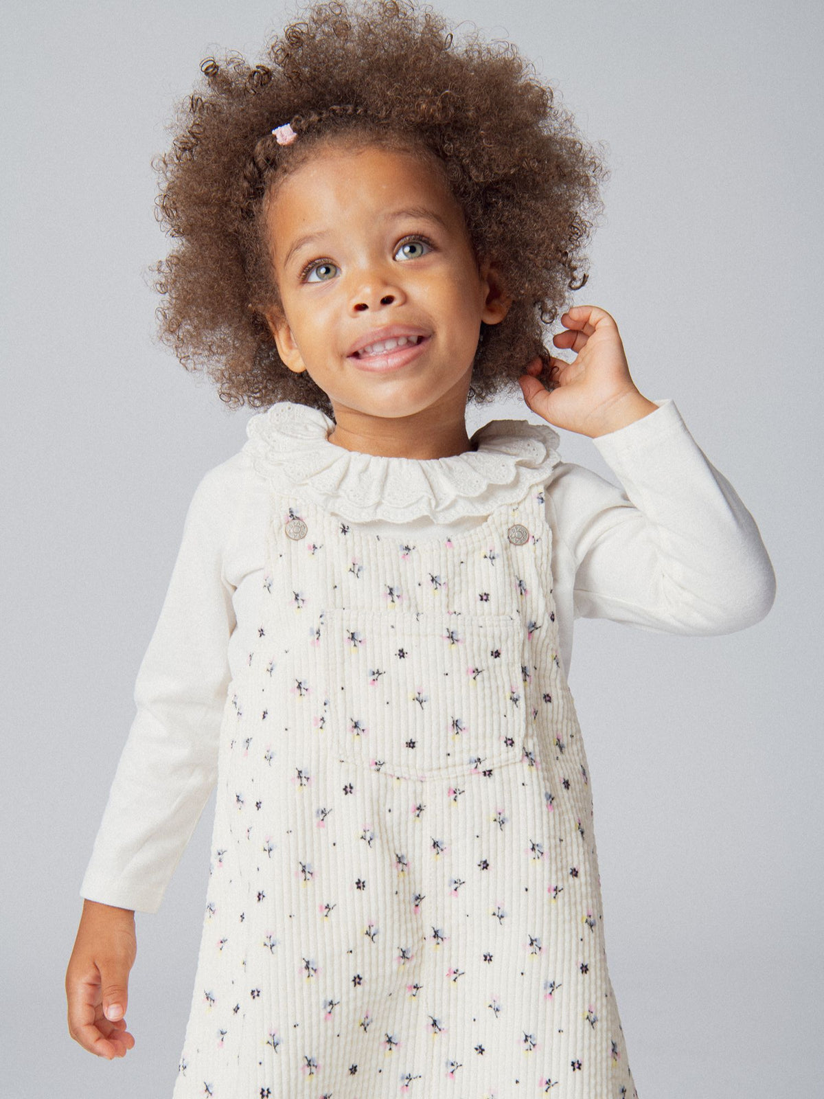 Corduroy dungaree dress with flower print for baby girl