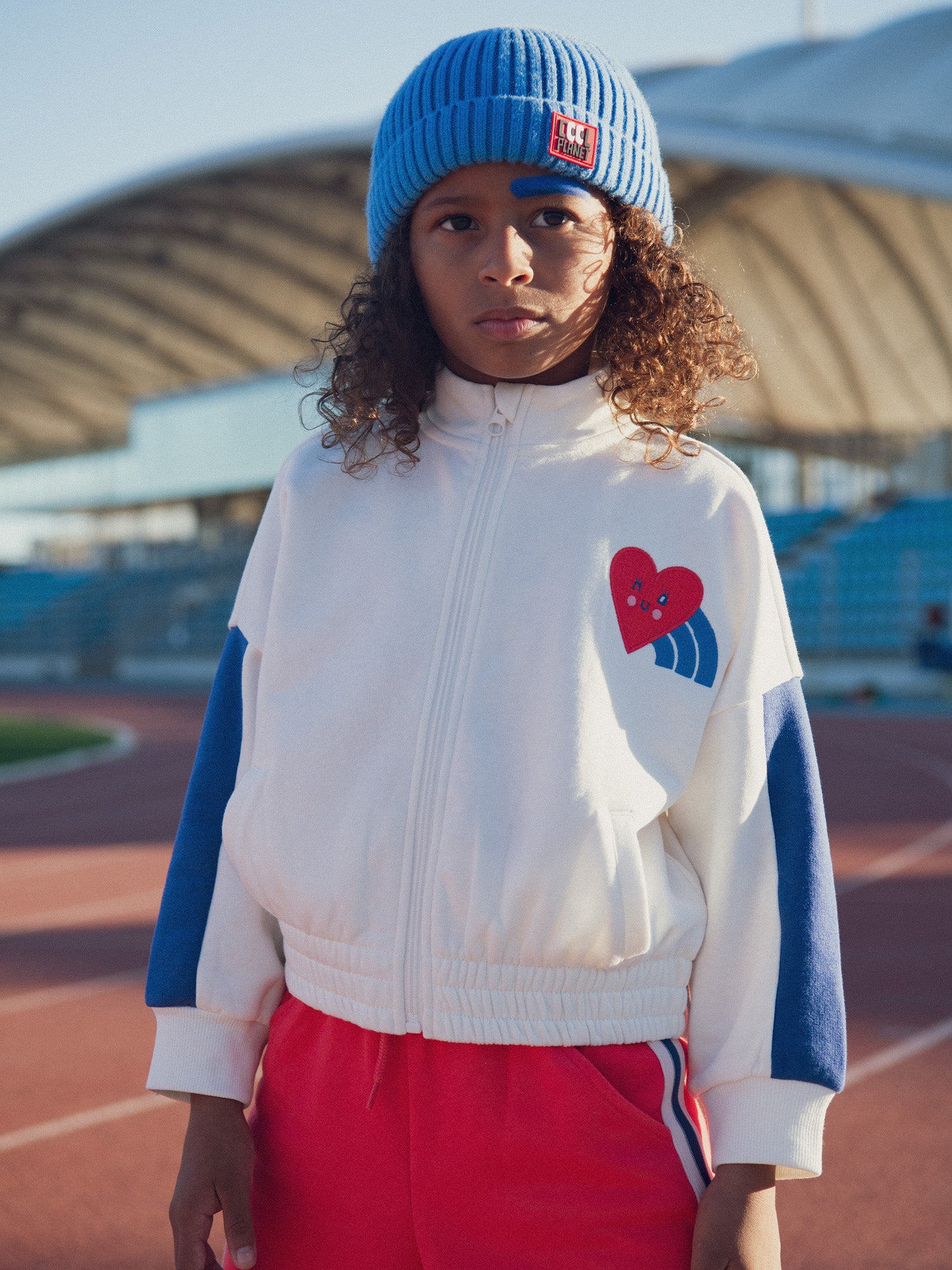 Ecru zip-up cardigan with chest badge for girls