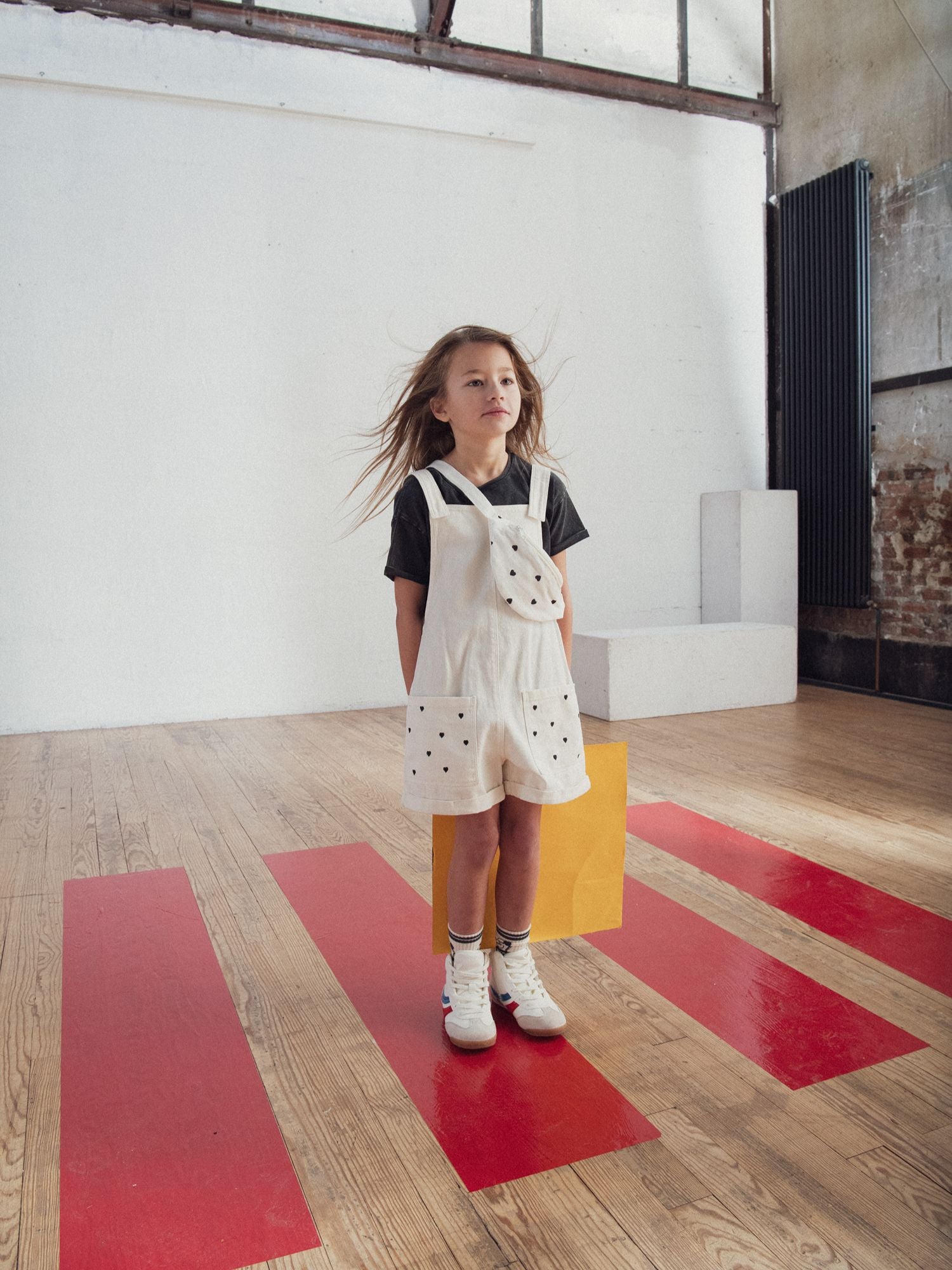 Short overall with heart embroidery for girls