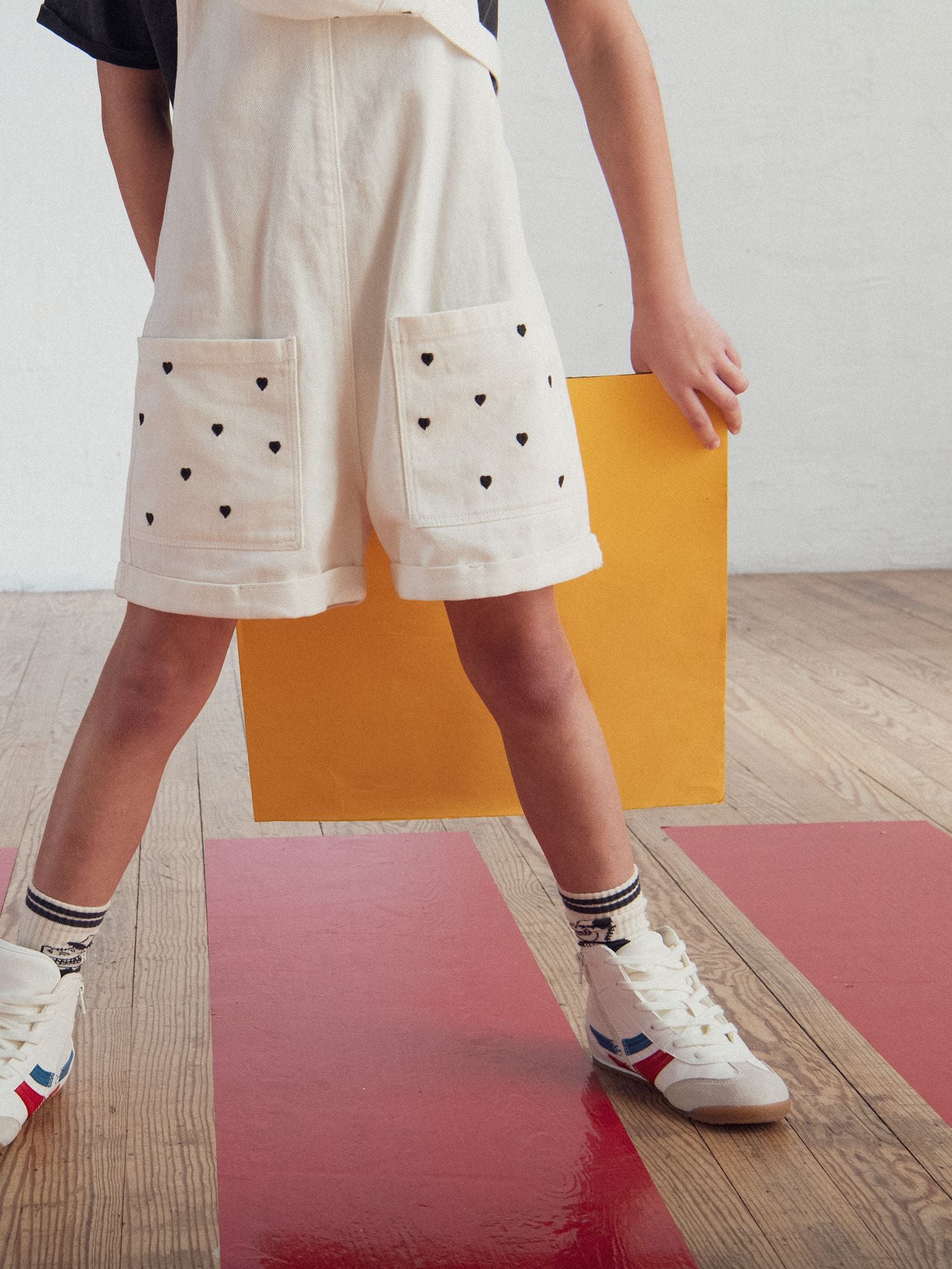 Short overall with heart embroidery for girls