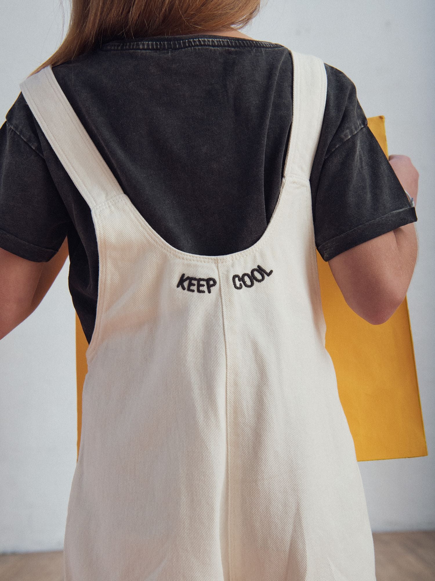 Short overall with heart embroidery for girls