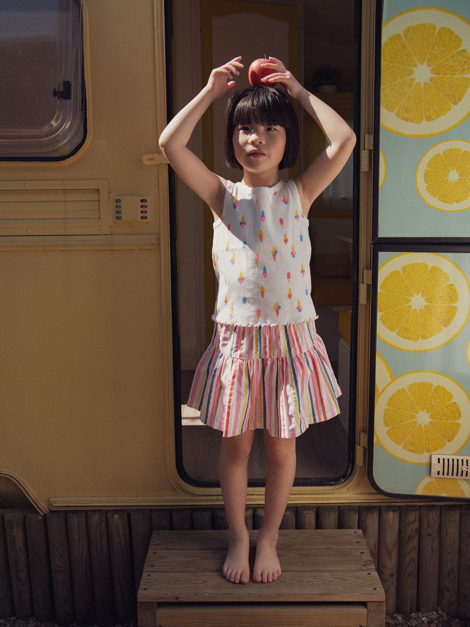Ecru skirt with integrated shorts and multicolored stripes for girls