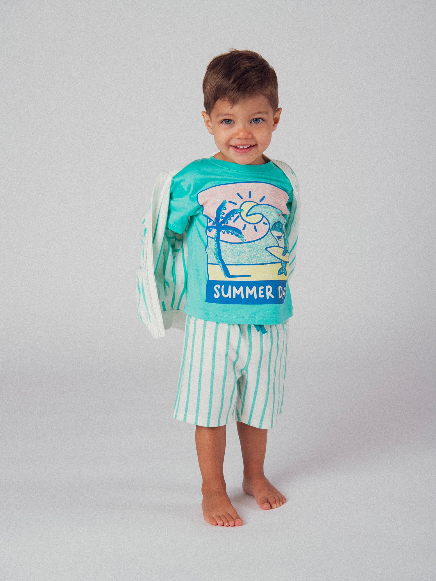 Striped aqua green shorts with "Fish" pocket for baby boy