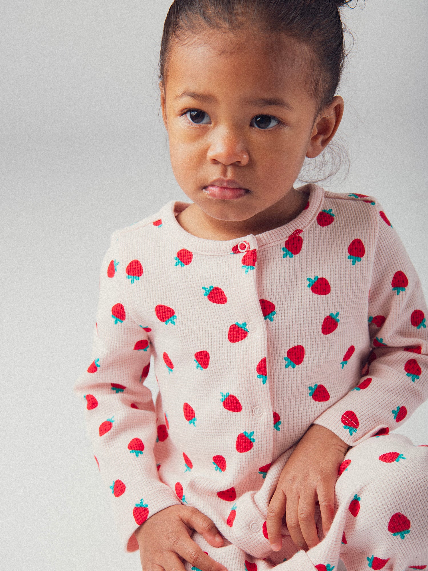 Pink romper with full strawberry print for baby girl