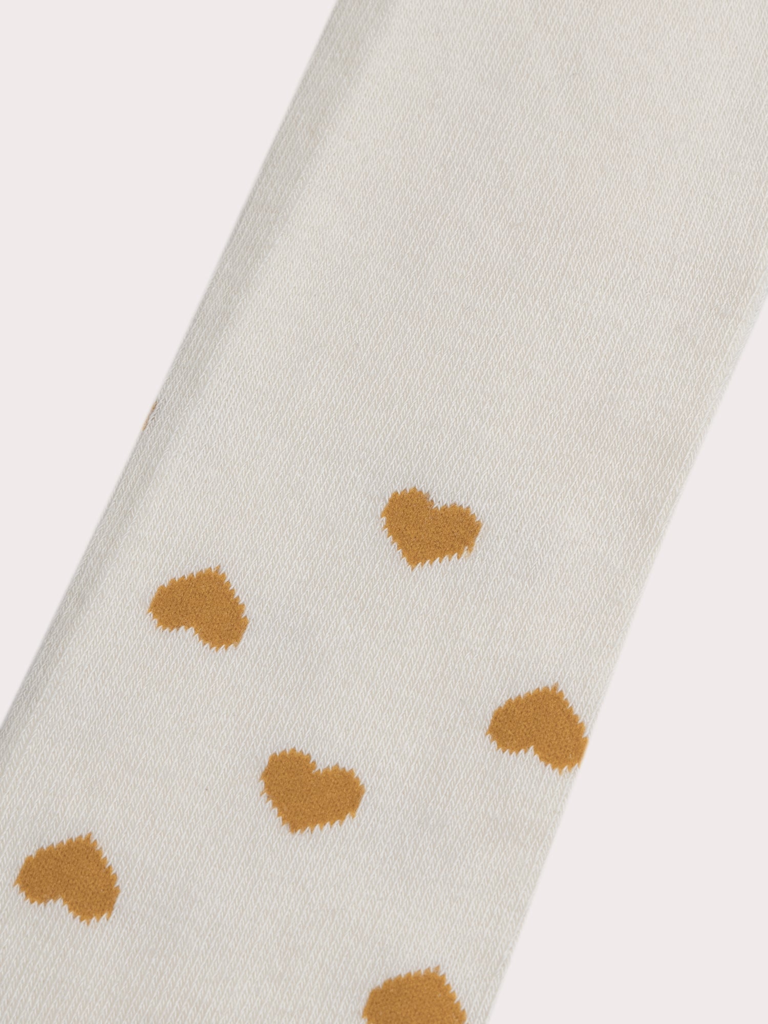 Beige tights with ochre hearts for girls