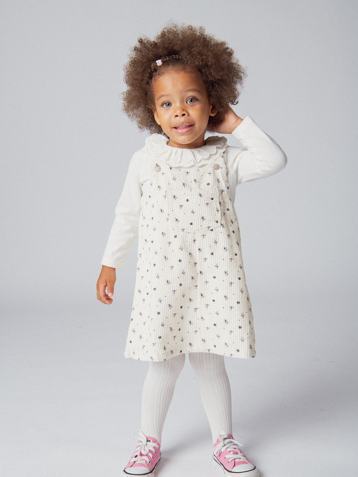 Corduroy dungaree dress with flower print for baby girl