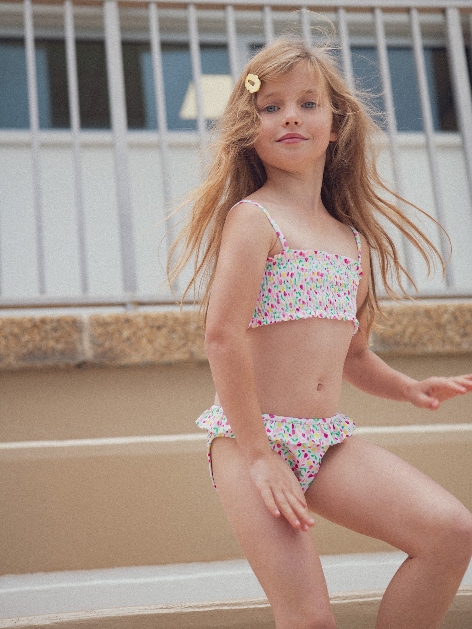 Two-piece cream swimsuit with cherry print for girls