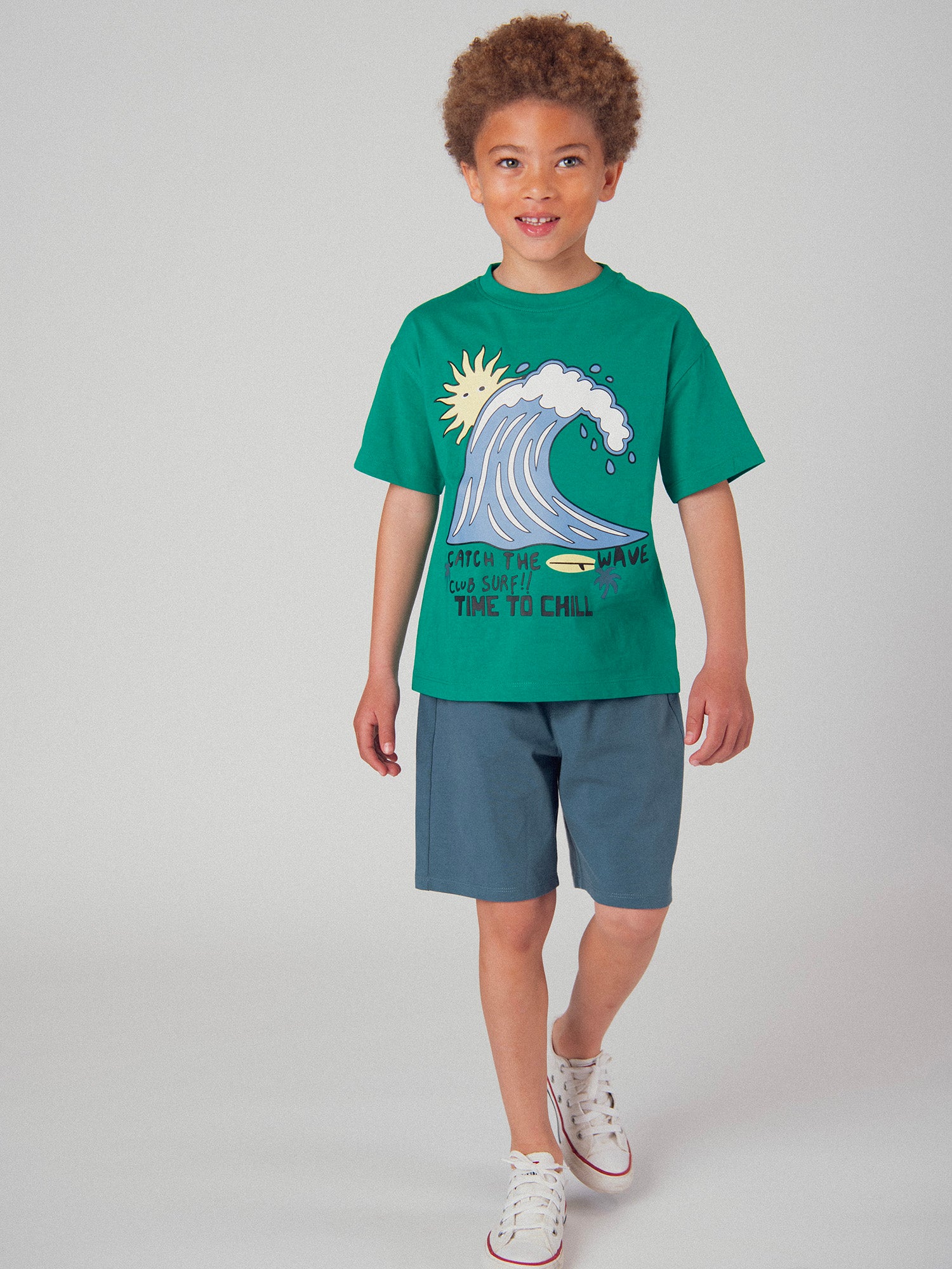 Green t-shirt and dark blue short set with animation for boys