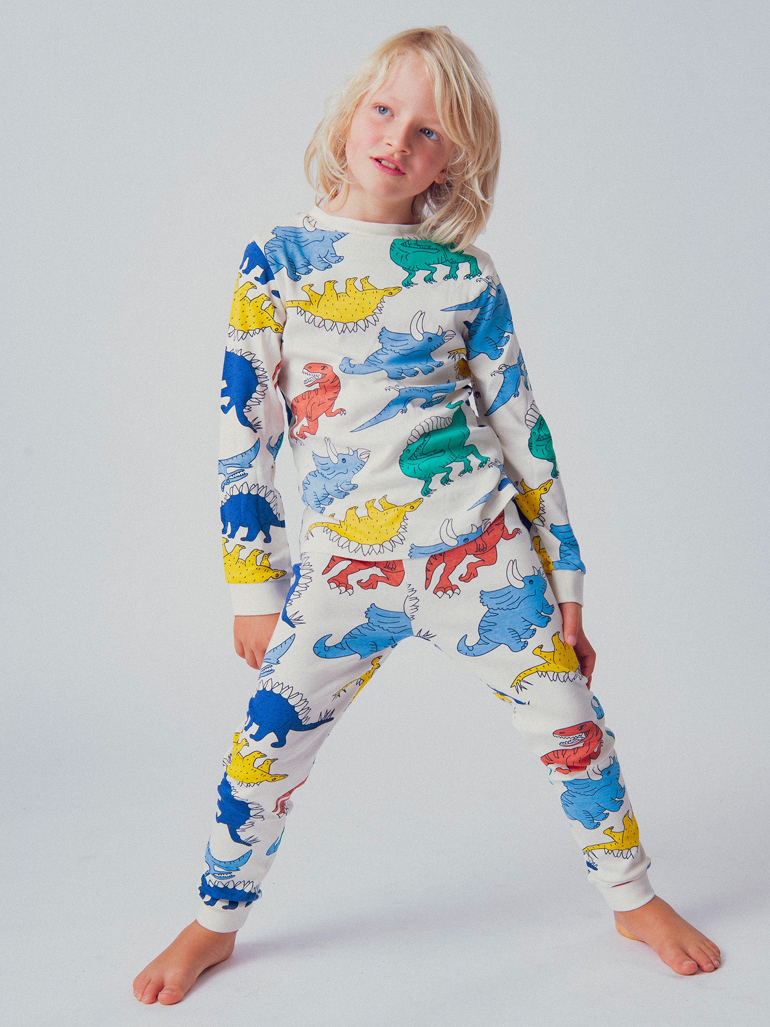 Ecru pyjama printed all over with dinosaur for boy