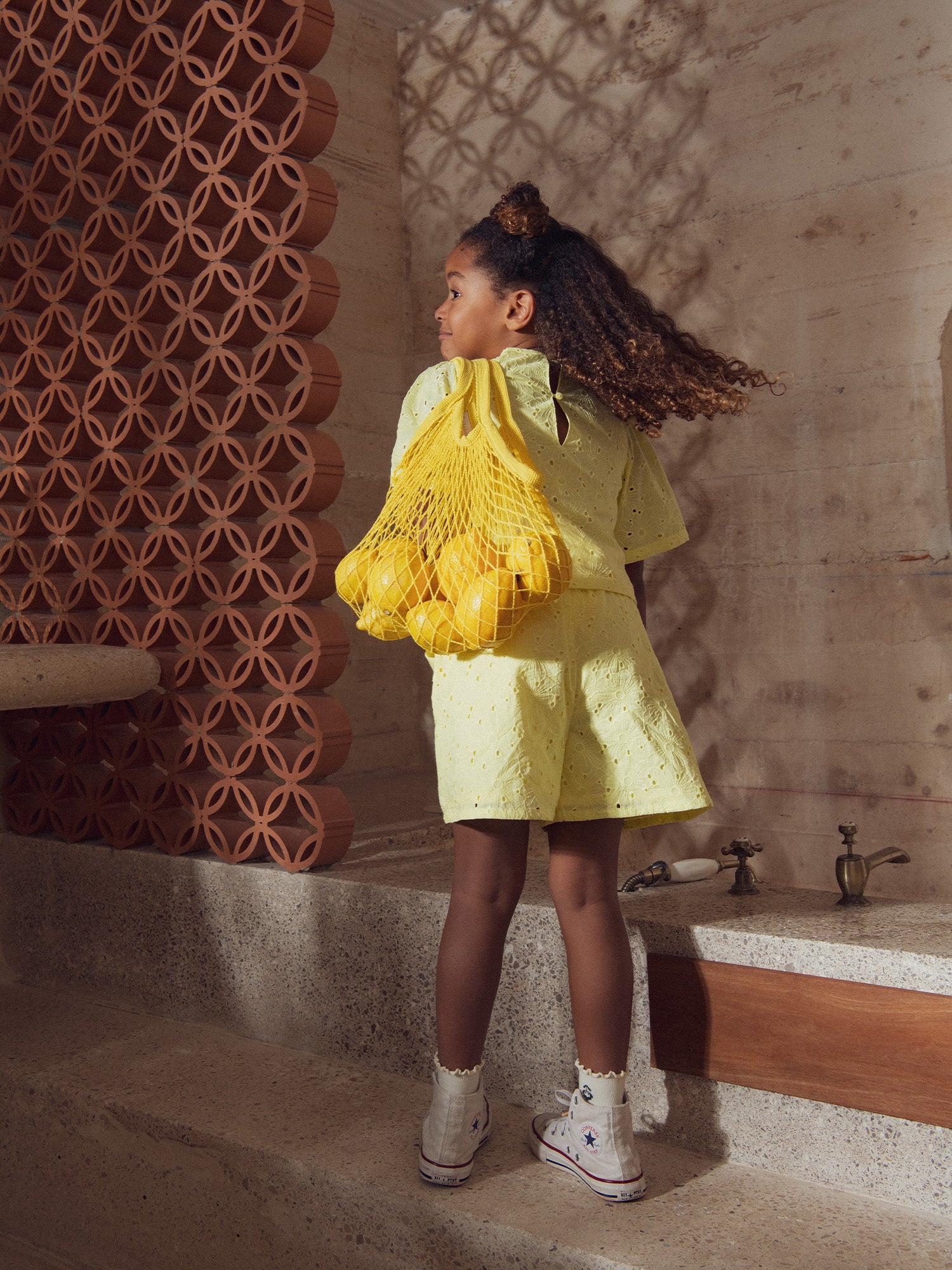 Pale yellow shorts in English embroidery for girls