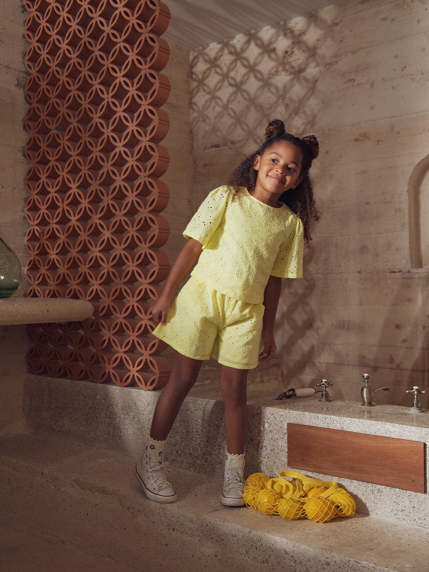 Pale yellow shorts in English embroidery for girls