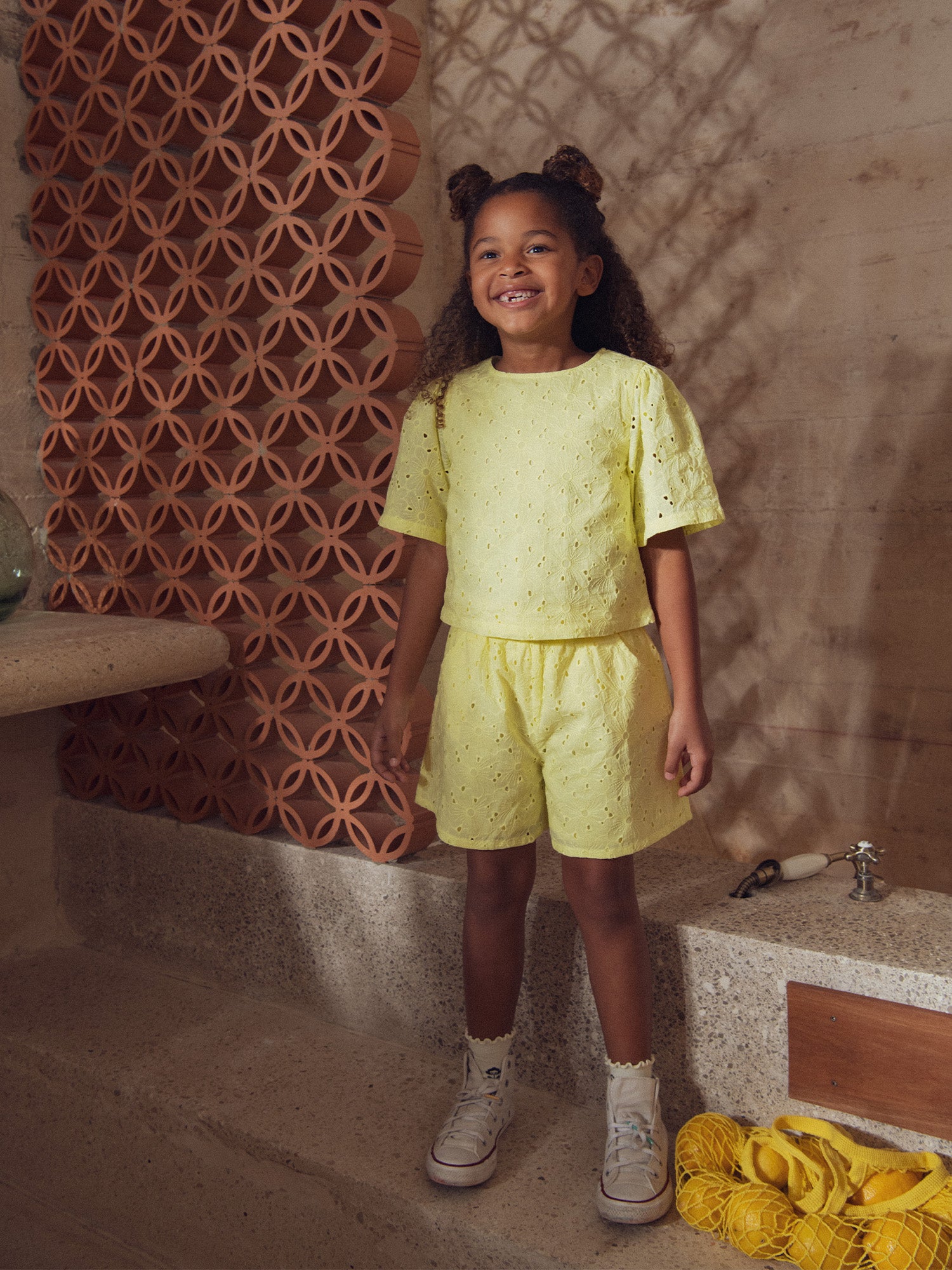 Pale yellow shorts in English embroidery for girls