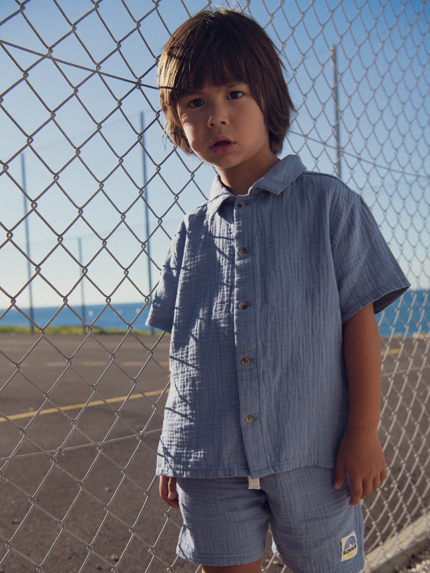 Blue shirt with fancy label for boys