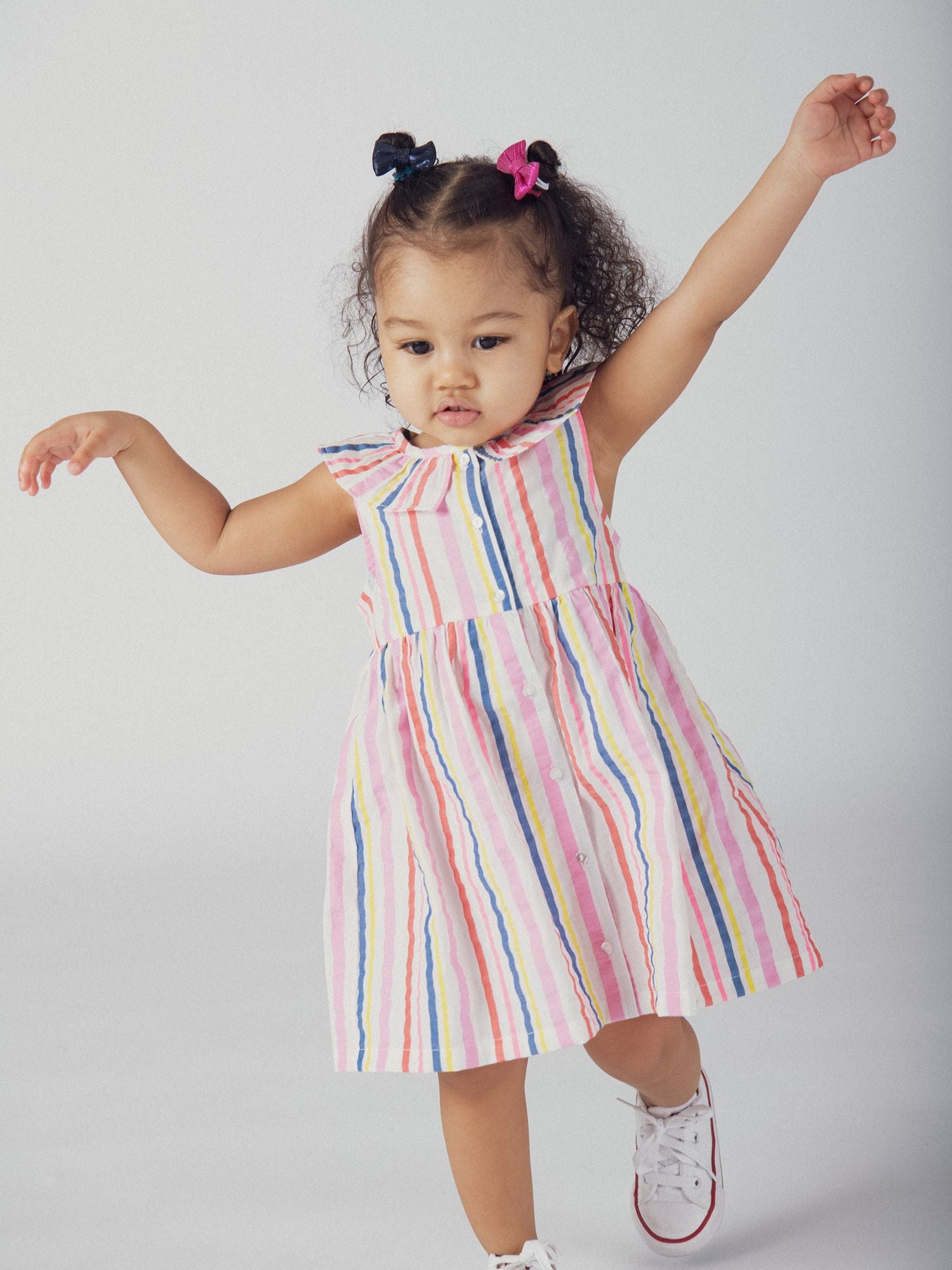 Multicolored striped dress with ruffled collar for baby girl