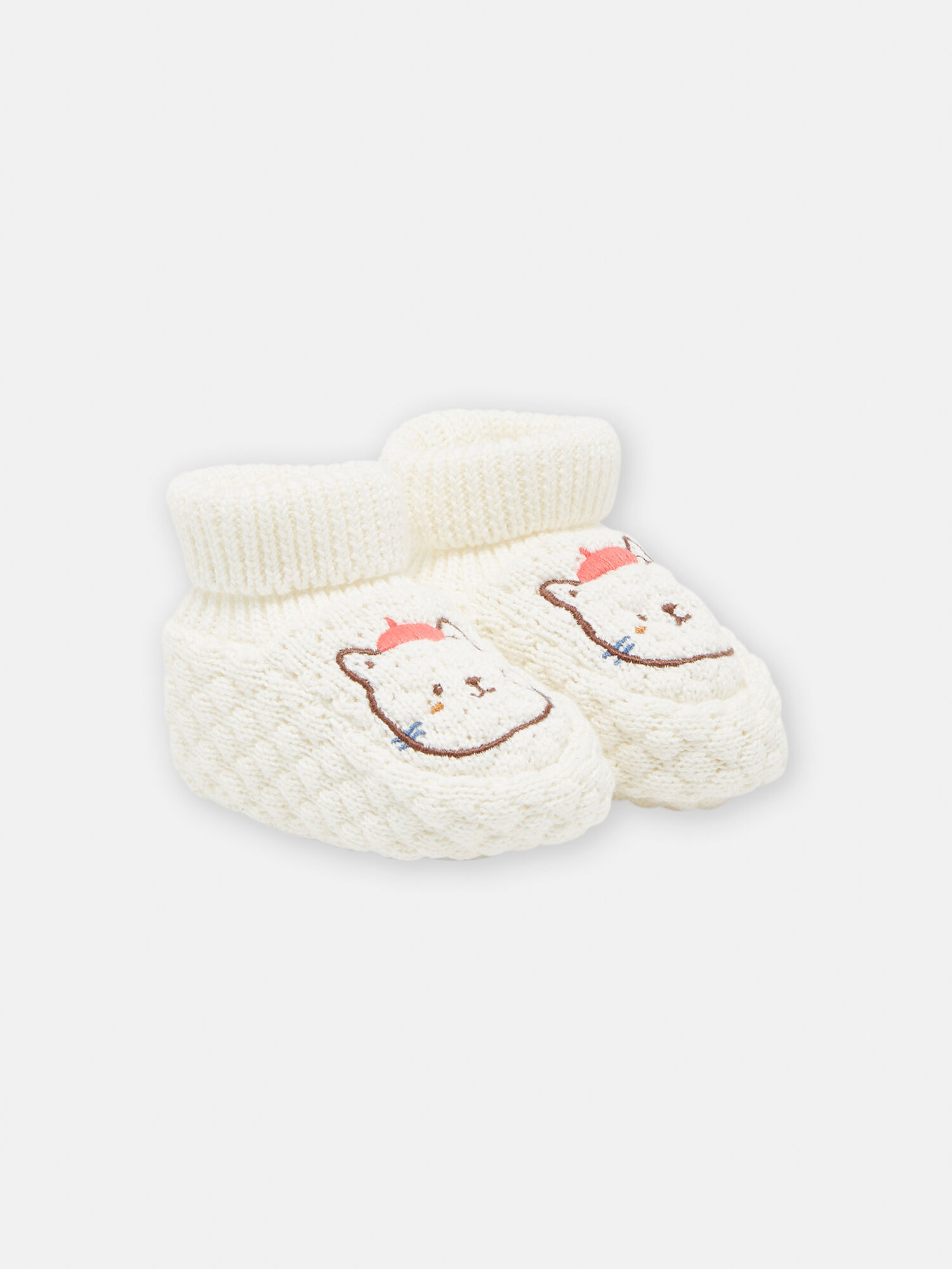 Off white baby booties with cat design
