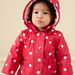 Hooded raincoat with polka dot print
